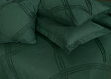 green design on bed sheet